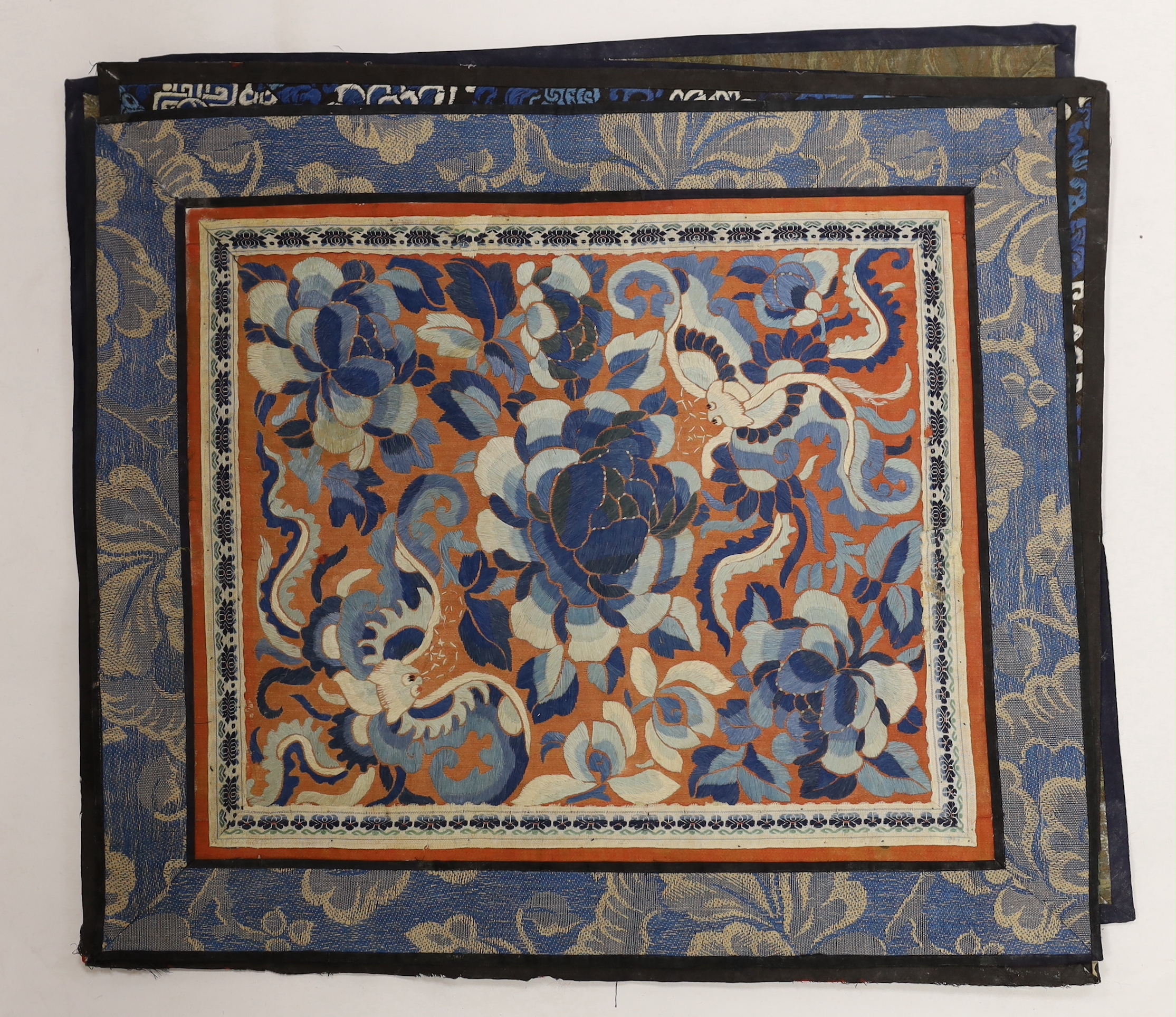 Nine Chinese silk embroidered panels, framed with silk damask borders, circa 20th century, largest 37cm x 41cm